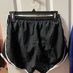 Nike running shorts. Black with white strips size Small